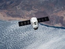 SpaceX Dragon over land and water